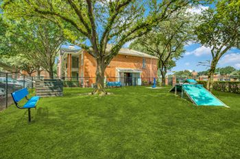 a backyard with a pool and trees and a house